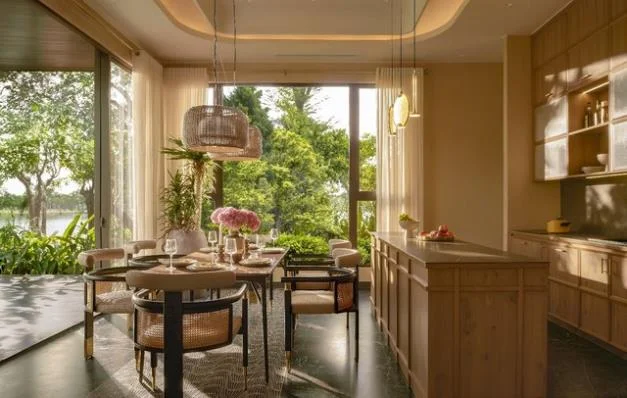 Model villa interior - kitchen and dining room with lake and forest garden view